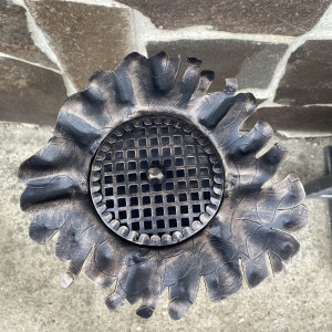 A wrought iron ashtray