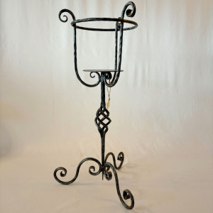 A wrought iron flowerpot
