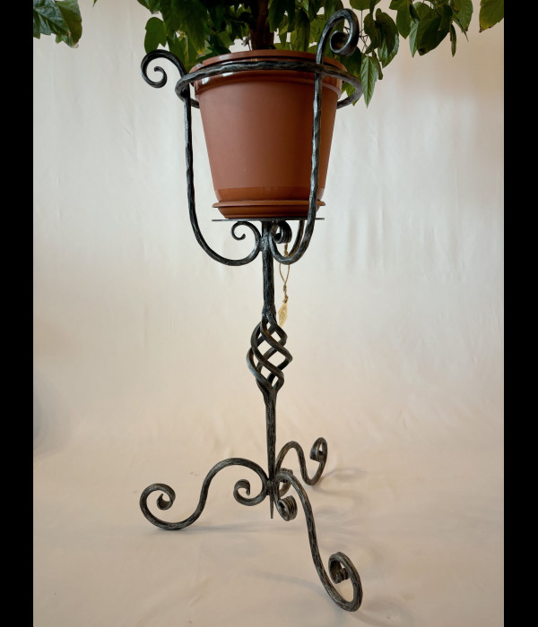 A wrought iron flowerpot