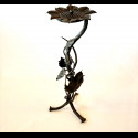 A wrought iron ashtray