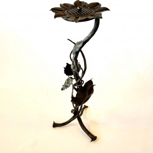 A wrought iron ashtray