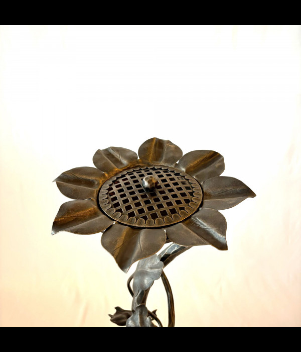 A wrought iron ashtray