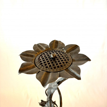 A wrought iron ashtray