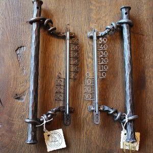A wrought iron thermometer
