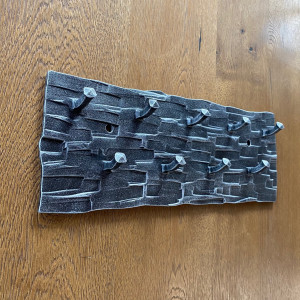 A wrought iron key holder
