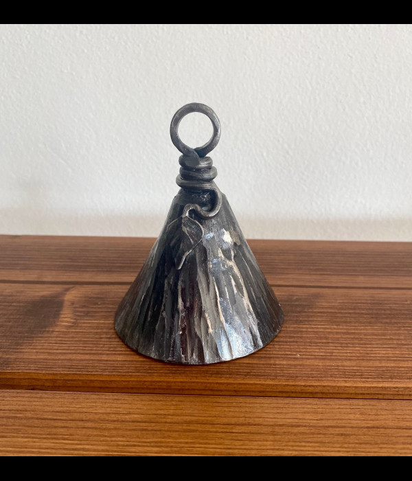 A wrought iron bell A wrought iron bell