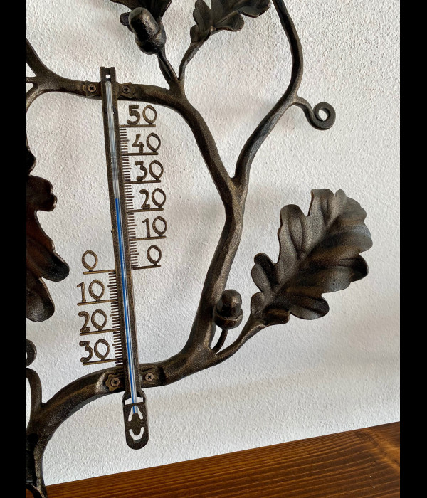A wrought iron thermometer Oak