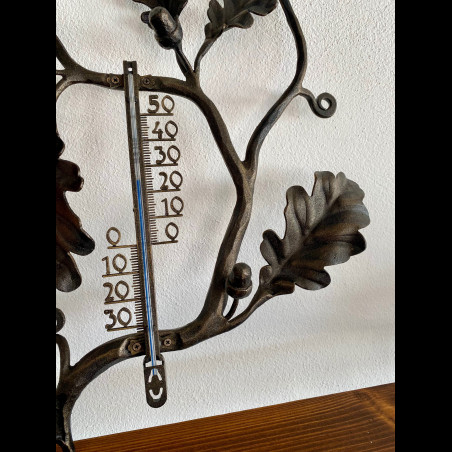 A wrought iron thermometer Oak