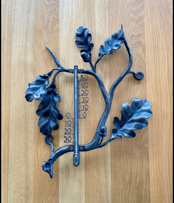 A wrought iron thermometer Oak