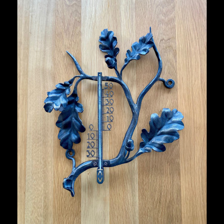 A wrought iron thermometer Oak