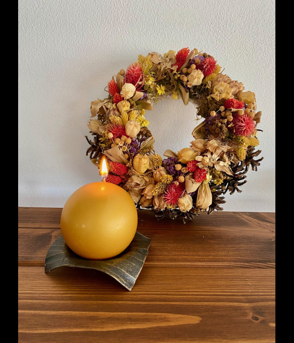 A wrought iron candle holder A wrought iron candle holder