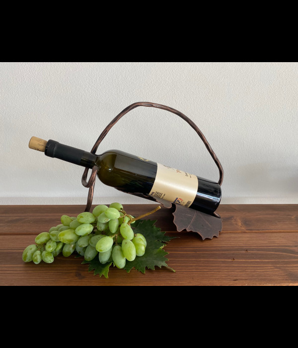 A wrought iron bottle holder