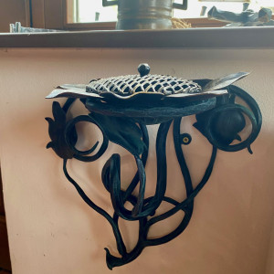 A wrought iron ashtray