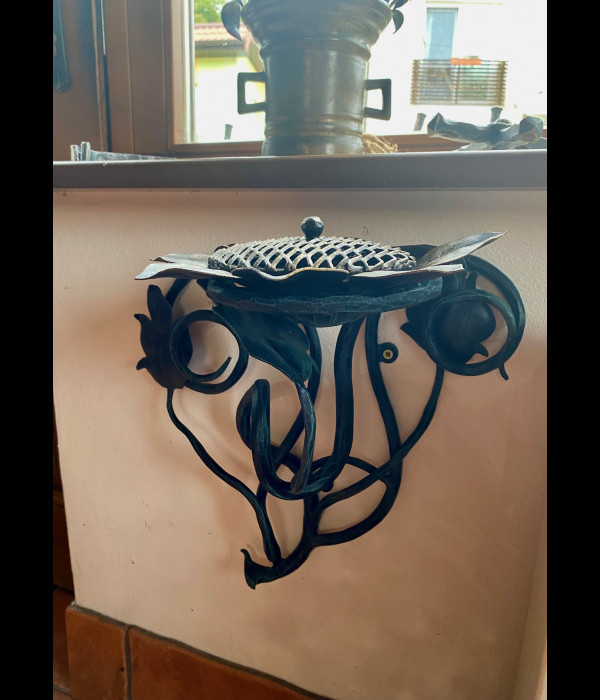 A wrought iron ashtray