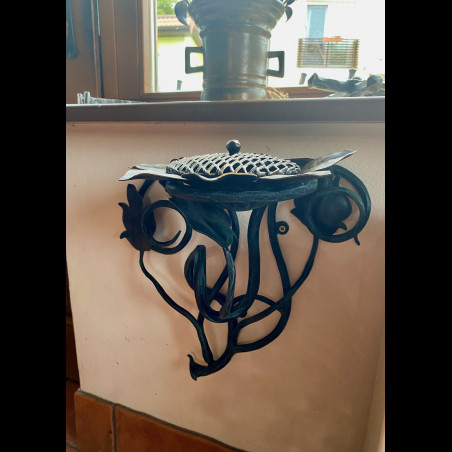 A wrought iron ashtray
