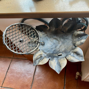 A wrought iron ashtray