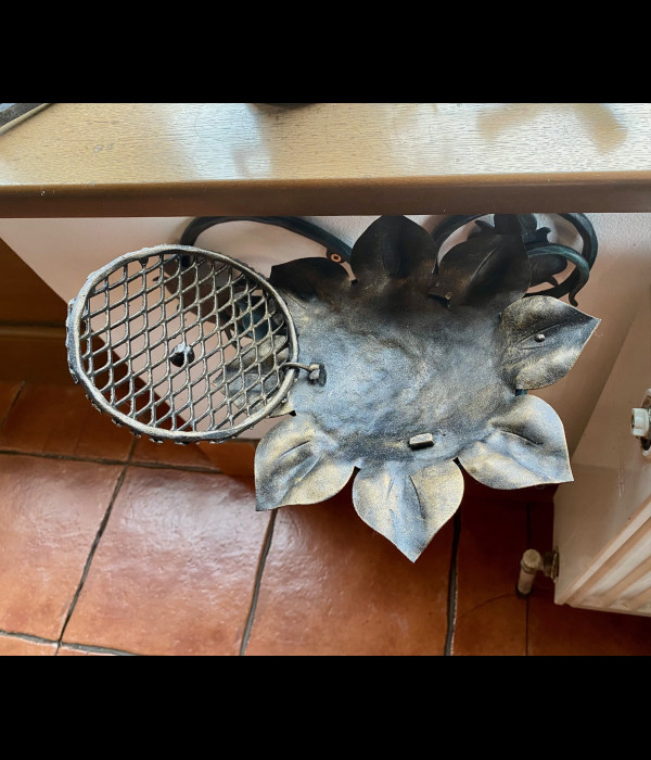 A wrought iron ashtray