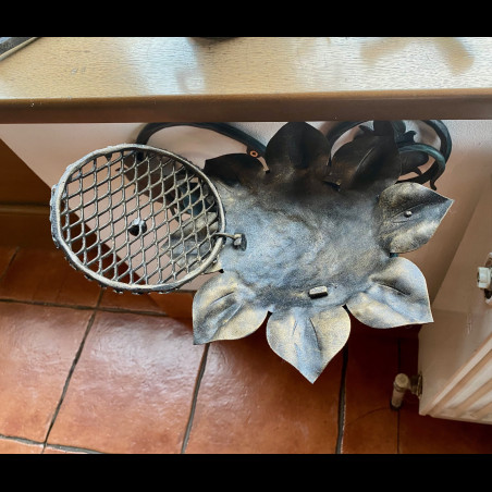 A wrought iron ashtray
