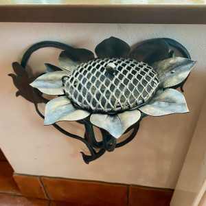 A wrought iron ashtray