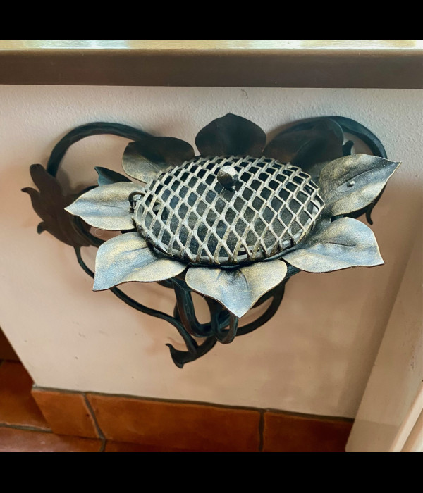 A wrought iron ashtray
