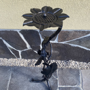 A wrought iron ashtray