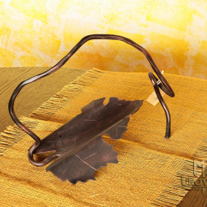 A wrought iron bottle holder