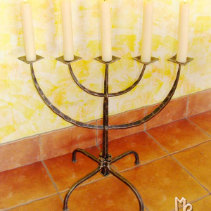 A wrought iron five-armed candelabra
